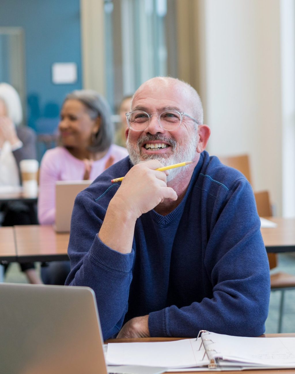 Students in adult ed class have fun Diverse group of students have fun during their adult ed class at the local college.