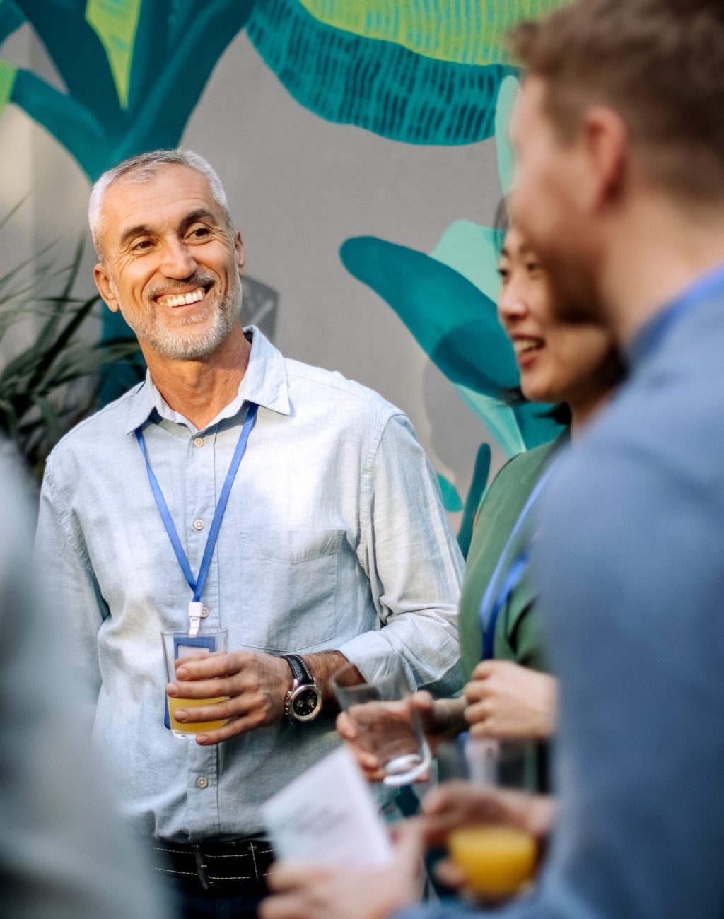 Colleagues enjoys their time while being on a break Group of business people in the conference room, having a casual conversation
